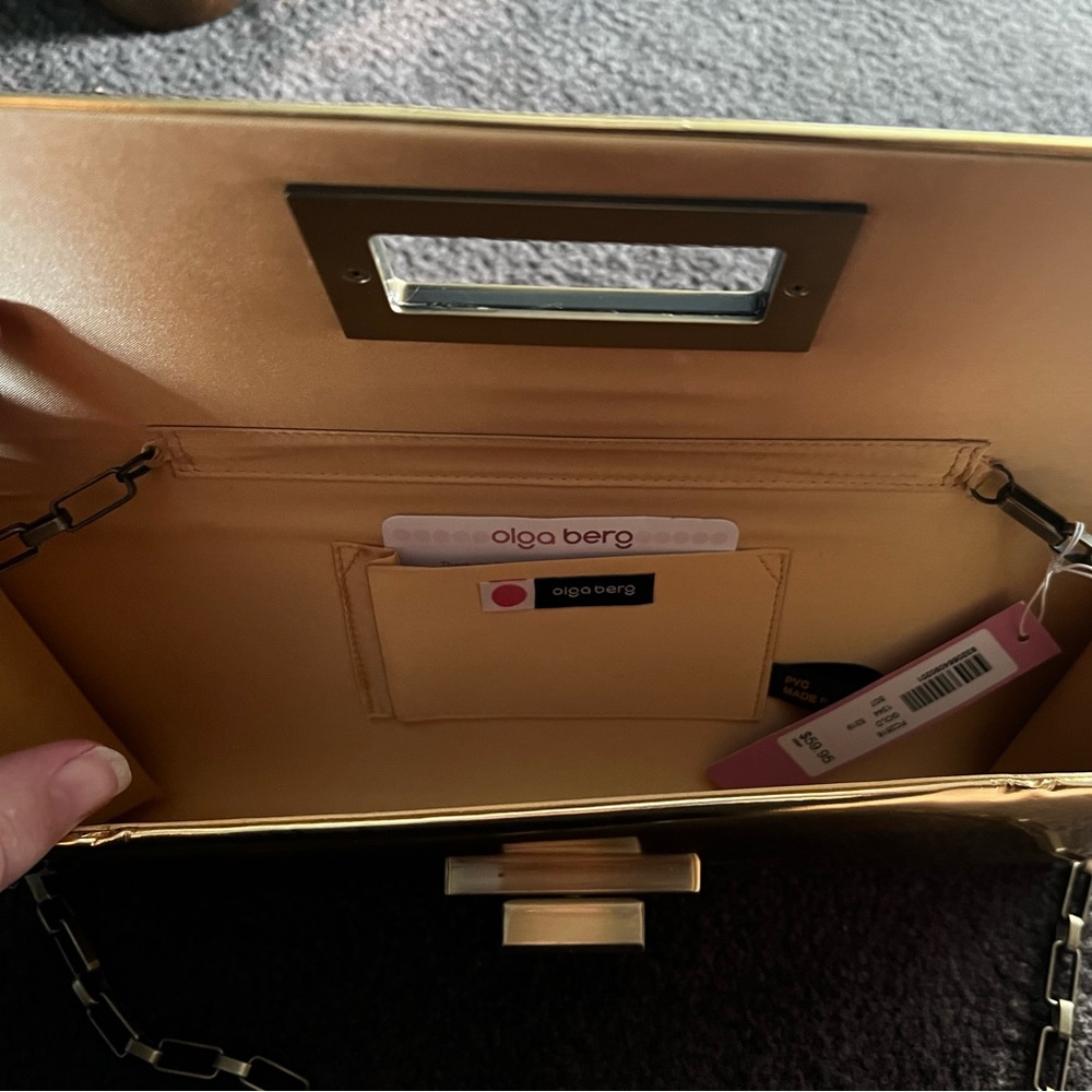 NWT - Olga berg gold clutch bag. NWT. Comes with chain strap. Rectangular clasp. - Picture 7 of 15